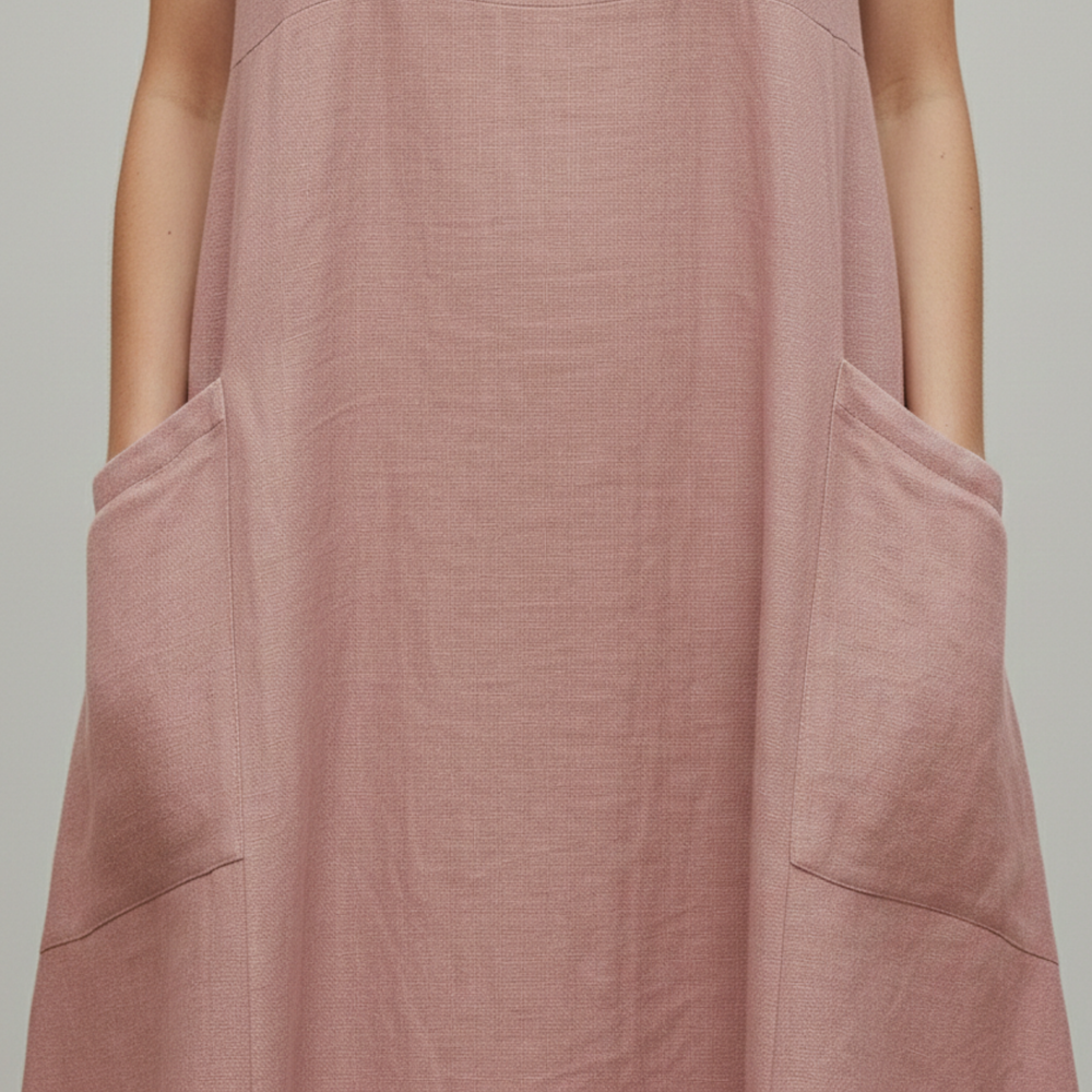  A woman in a pink sleeveless midi dress for warm-weather outings.