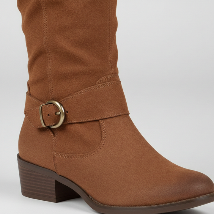 A pair of knee-high brown boots with side buckles, featuring a smooth finish and low stacked heel for comfort and style.