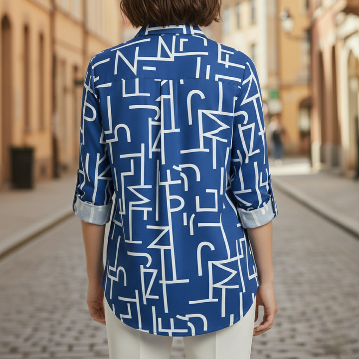 Blue geometric print shirt with a tailored silhouette, long sleeves, and a polished collar, ideal for fall and spring fashion.