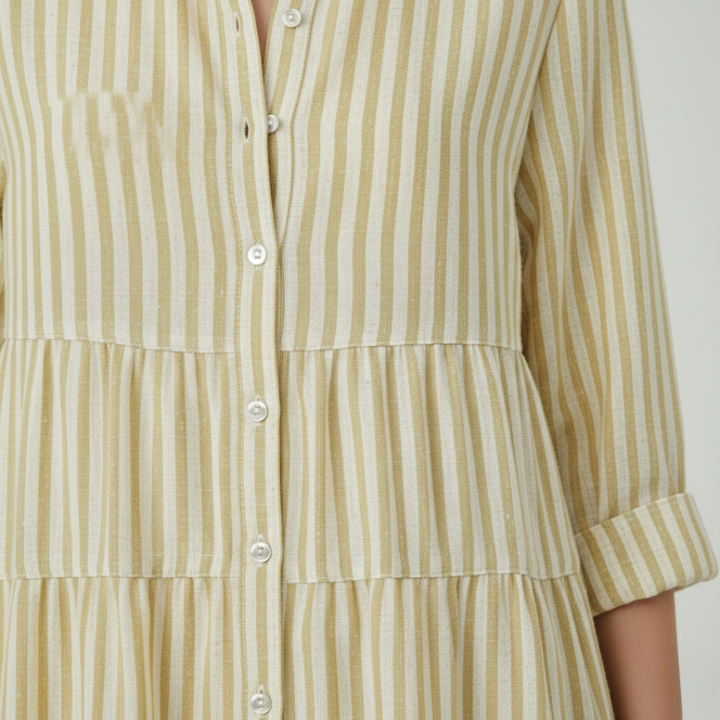  yellow striped shirt dress-close up details with a turn-down collar and flowing skirt, ideal for casual gatherings in warm weather.