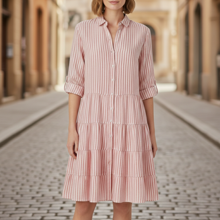 light red striped shirt dress with a turn-down collar and flowing skirt, ideal for casual gatherings in warm weather.