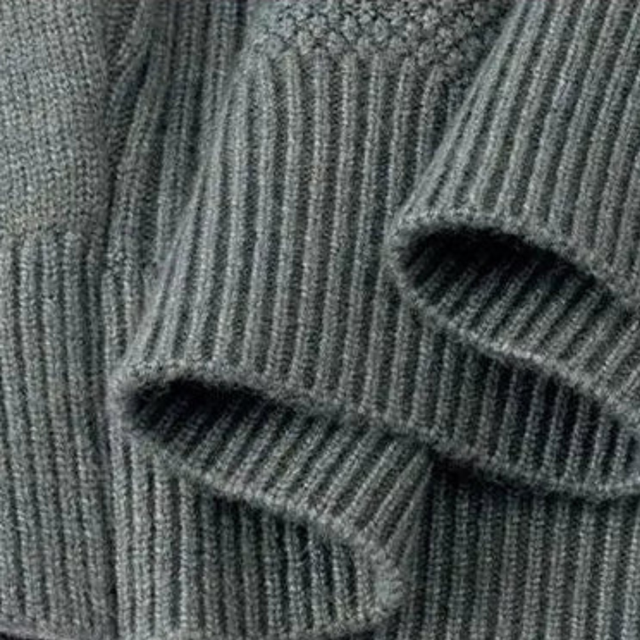 Avelise The Orion textured knit sweater featuring a close-up of the cozy, patterned fabric in neutral tones.