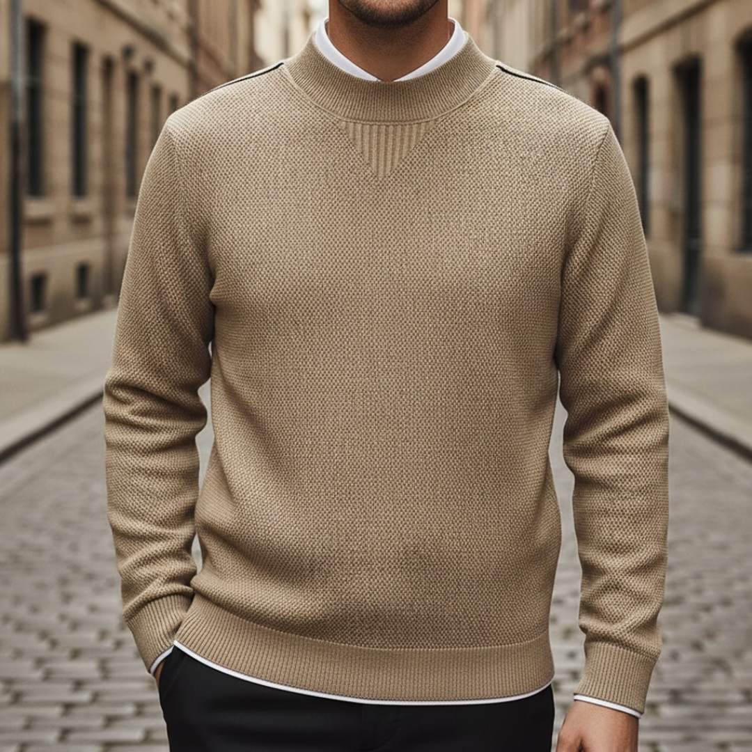 A close-up of Avelise The Orion textured knit sweater showcasing its detailed knit pattern in soft, cozy yarn.